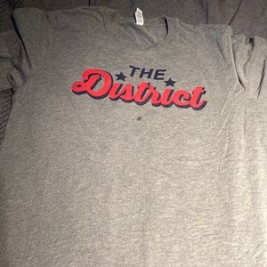 grey shirt the district